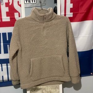 fuzzy sweater it says it’s a xs but i think it runs bigger